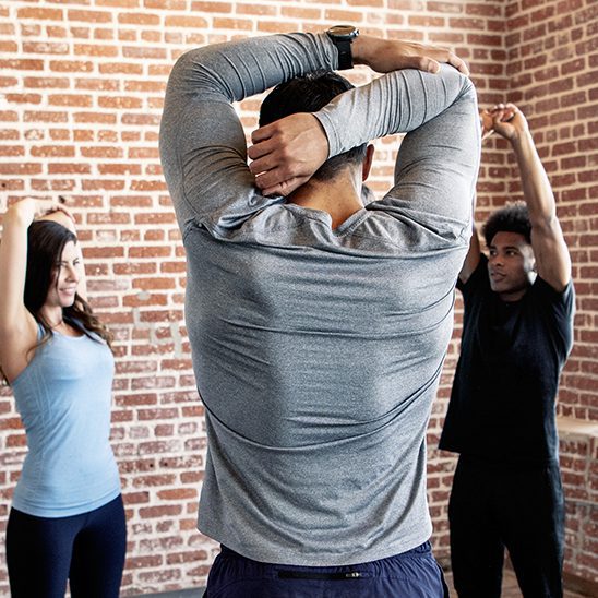 People stretching in a yoga studio